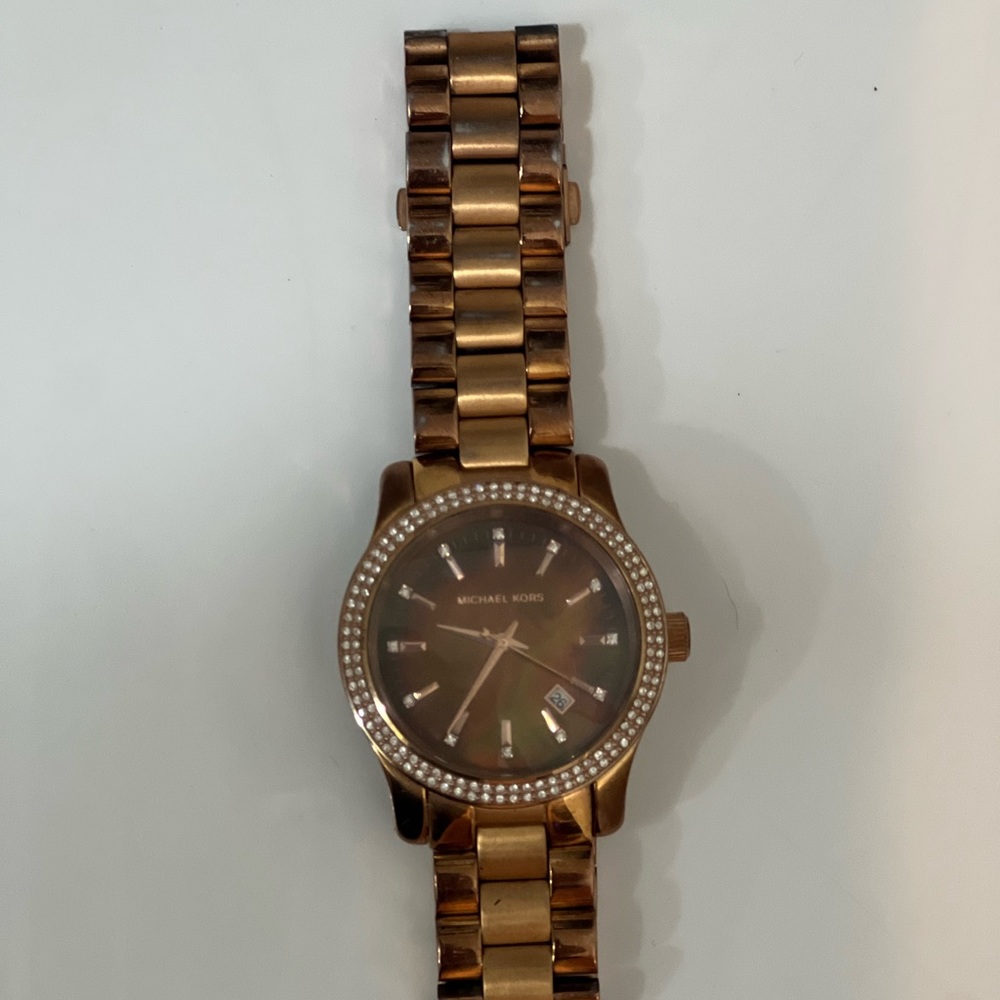 Michael Kors women’s watch. Used but good condition. Needs battery